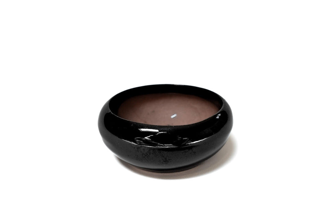 black glazed ceramic dish